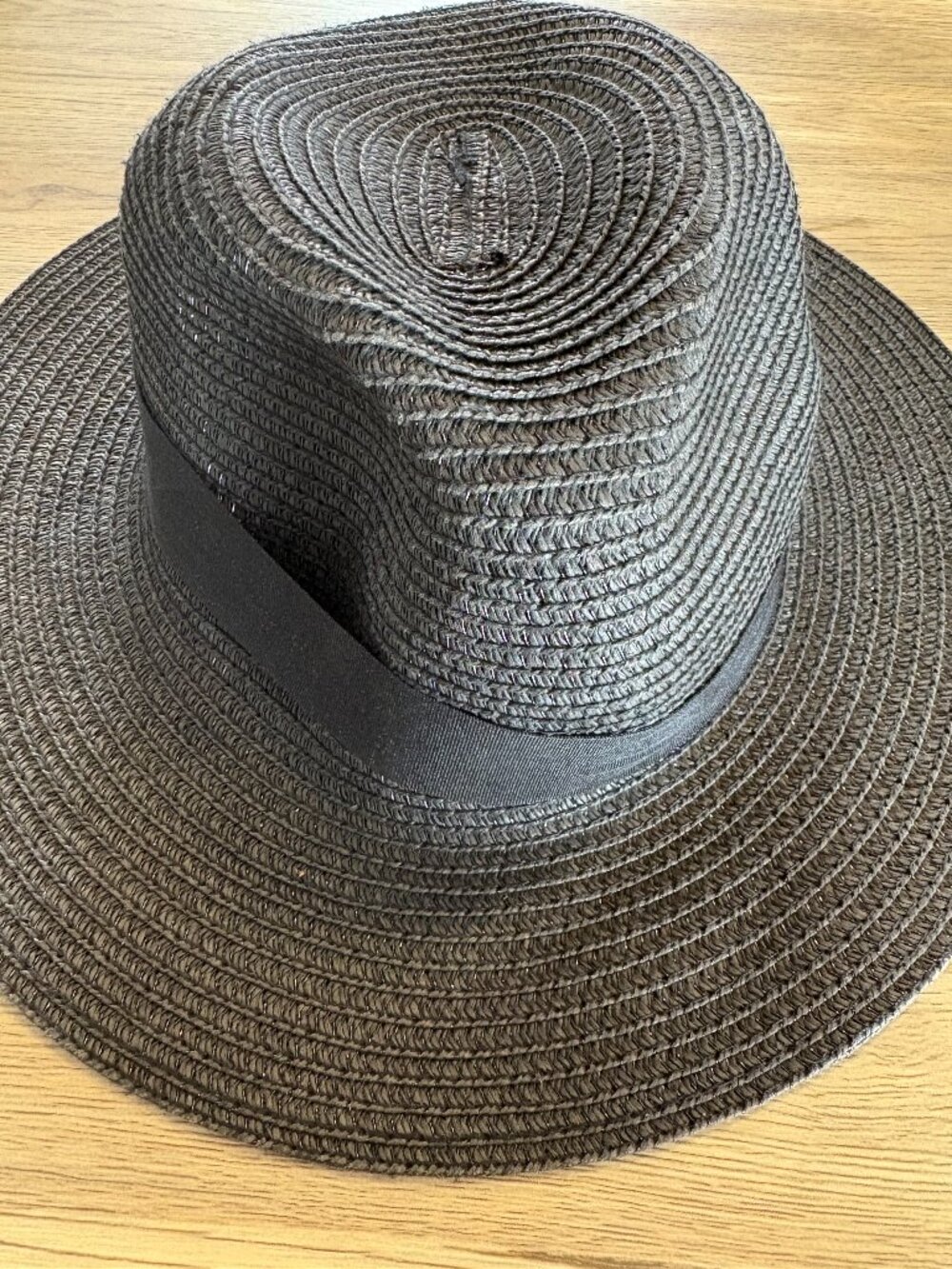 Stylish black woven fedora style sun hat with a ribbon band